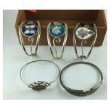 Five silvertone bracelets