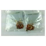 Two pairs of redskins earrings