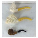 Three smoking pipes