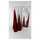Three topiary holiday trees with box