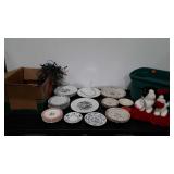 Mixed China plates, candles, holiday lights and