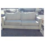 Tan sofa with dirt stains from being hauled