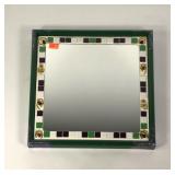 Tile and jewelry edged mirror, signed, 15x15