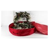 Two holiday wreaths in a canvas storage tote