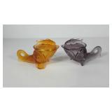 Two glass fish dishes with lids, note purple has