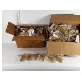 Two boxes full of poly golden angel ornaments, a