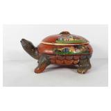 Decorative ceramic turtle dish with lid, has