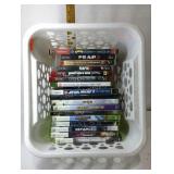 Plastic basket with console games, PS2, PS3, WIi,