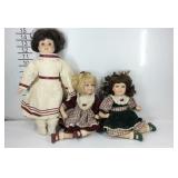 Three porcelain dolls, slightly  dusty could use