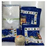 Christmas theme placemats, tablecloth, and candle