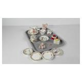 Miniature china pitchers, butter pats, trinket