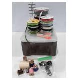 Storage organizer drawer full of ribbon, spools