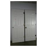 Two interior 6 panel 30" hollow core doors, used