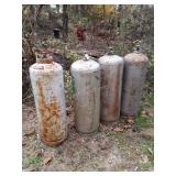 4 Older Propane Tanks, I believe 100lbs type.