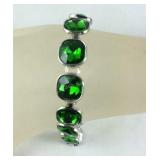 Simulated emerald 8in silvertone tennis bracelet