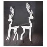 Two glass reindeer figurines