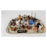 Twenty-five Scottish Terrier figurines, including
