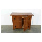 Rustic, possibly handmade cart on wheels, wormy