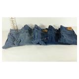 Five pair of blue jeans, previously worn. Levis,