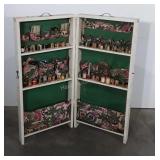 Portable sewing cabinet with spools of thread,