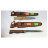 Two  knives with cases one is sharp and one is