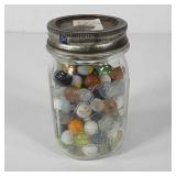 Pint sized Ball jar full of marbles