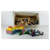 Box of Brio and brio style toy trains with