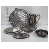 Metalwares group, includes plates, platters,