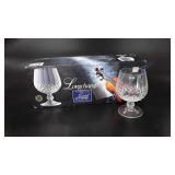 Set of four crystal longchamp glasses in box