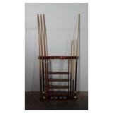 Pool cue rack and six pool cues, rack: 27x32,