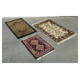 Three rugs, two scatter and one prayer rug