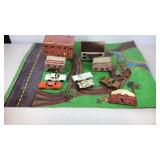 Cardboard road map with buildings and toy cars