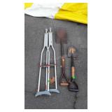 Two shovels and a pair of crutches