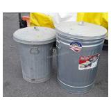 Two galvanized trash cans one is a 31 gallon