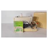 Singer sewing machine with top, powers up