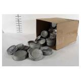 Box of zinc canning lids with milk glass inserts,