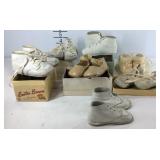 Seven pairs of vintage baby shoes