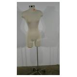 Mannequin torso, female form, dented as shown