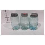 Three Mason jars, includes two Whitney and one