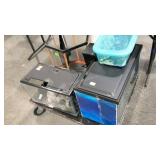 Group of small fish tanks and accessories, cart