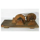 Wooden pulleys with leather straps,  base