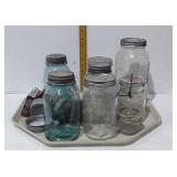 Canning jars including two blue ones and a half