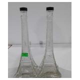 Two glass Eiffel tower bottles