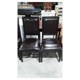Two vinyl dining chairs