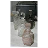 Four glass decanters