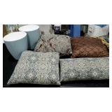 Six decorative pillows and two trashcans