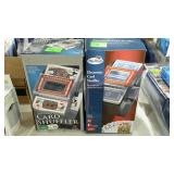 Two electronic card shufflers, in box