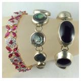 Three Sterling bracelets, black stone won
