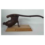 Cast iron sausage stuffer mounted on wood