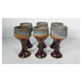 Set of six pottery gaunlets, one is chipped, 8"